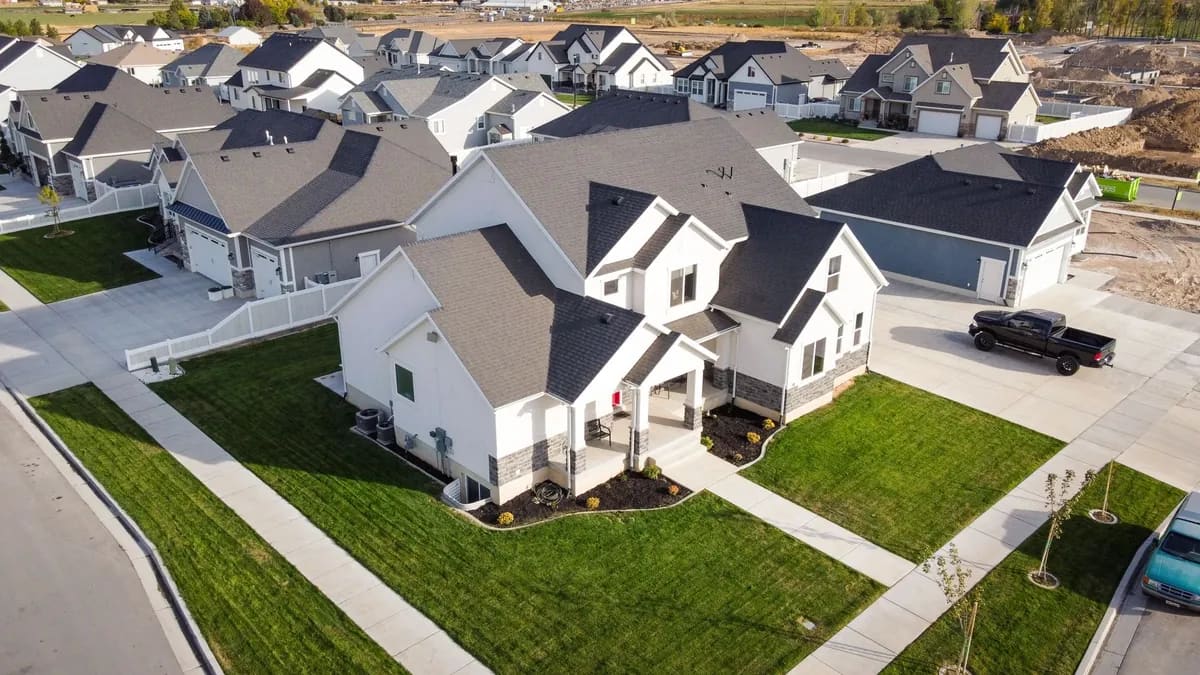 Aerial view of a new subdivision where every house carries the same roof, put on in the same season